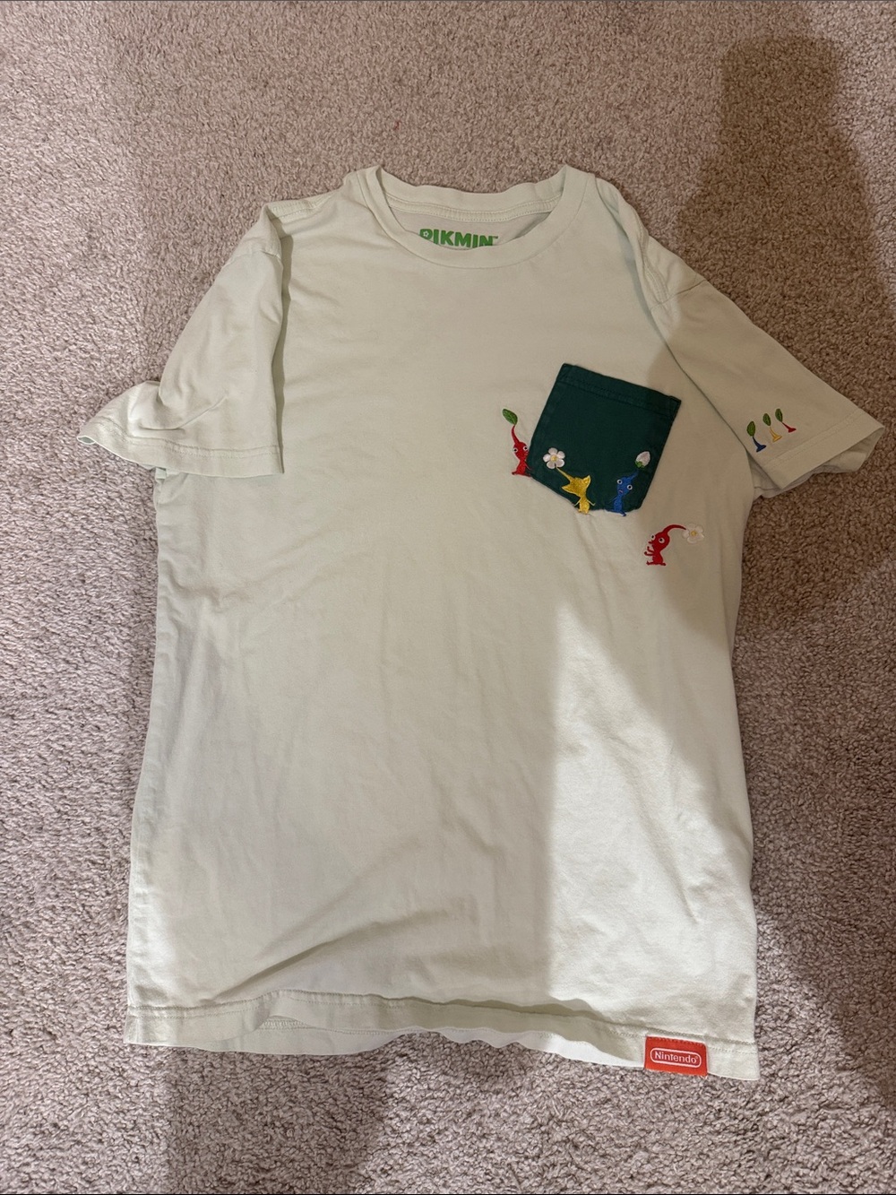 Nintendo Light Green Short Sleeve Tee with Dark Green Pocket and Pikmin Accents